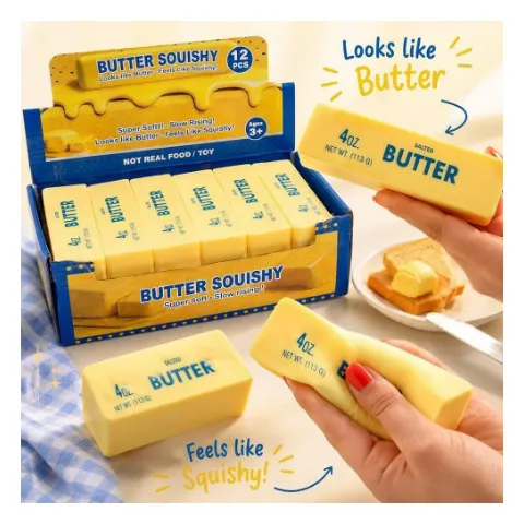 Squishy in Form eines Butterstücks, eine Hand drückt es zusammen