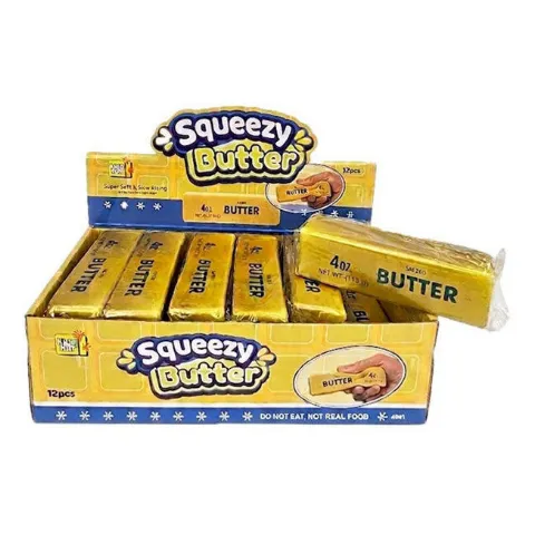 Goldene Squishy-Butterstücke in gelben Schachteln